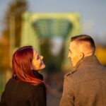 man and woman standing side by side during daytime